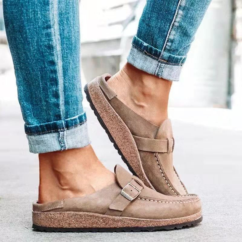 Taupe backless clogs with closed toe and adjustable buckle strap