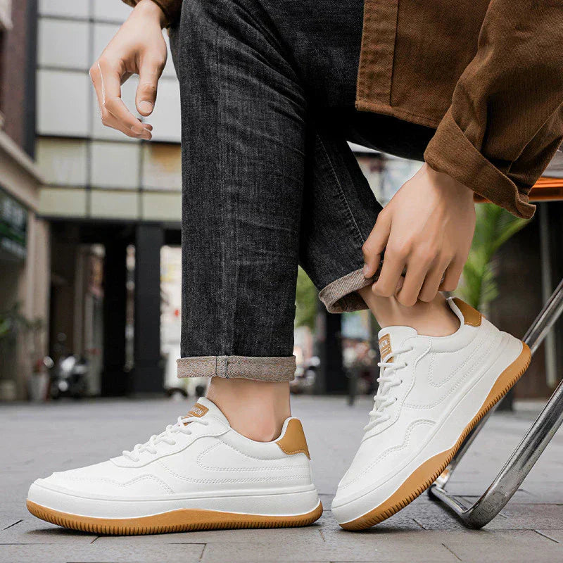 Men's white premium smooth-finish trainers with a clean low-profile silhouette and refined upper