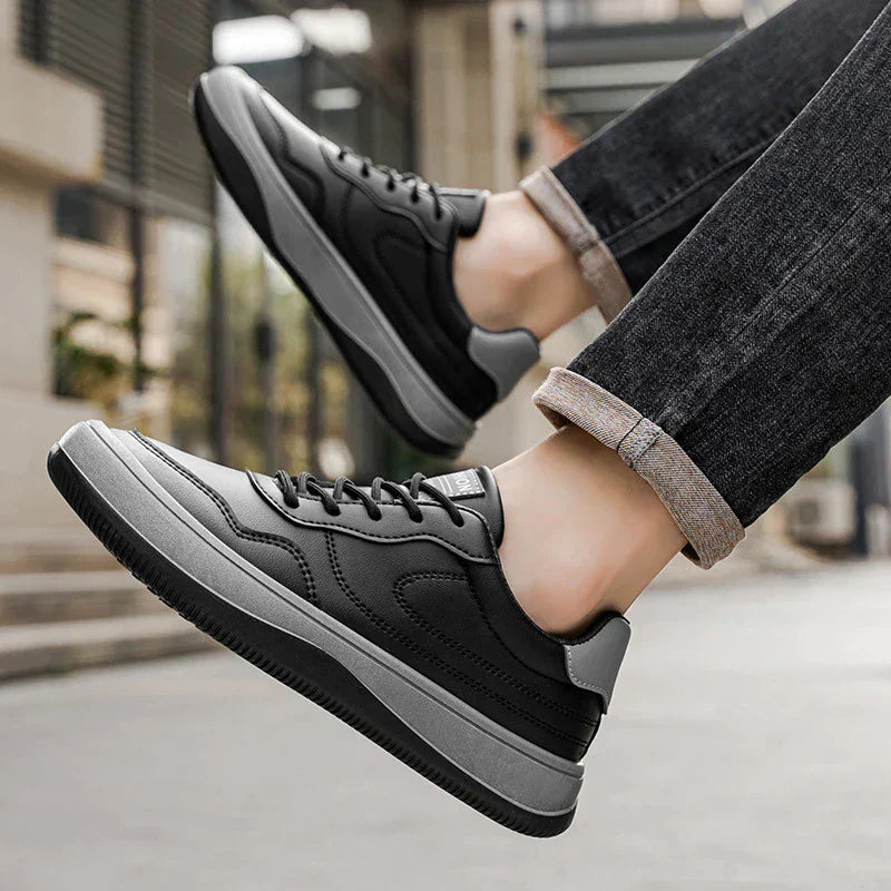 Men's white premium smooth-finish trainers with a clean low-profile silhouette and refined upper
