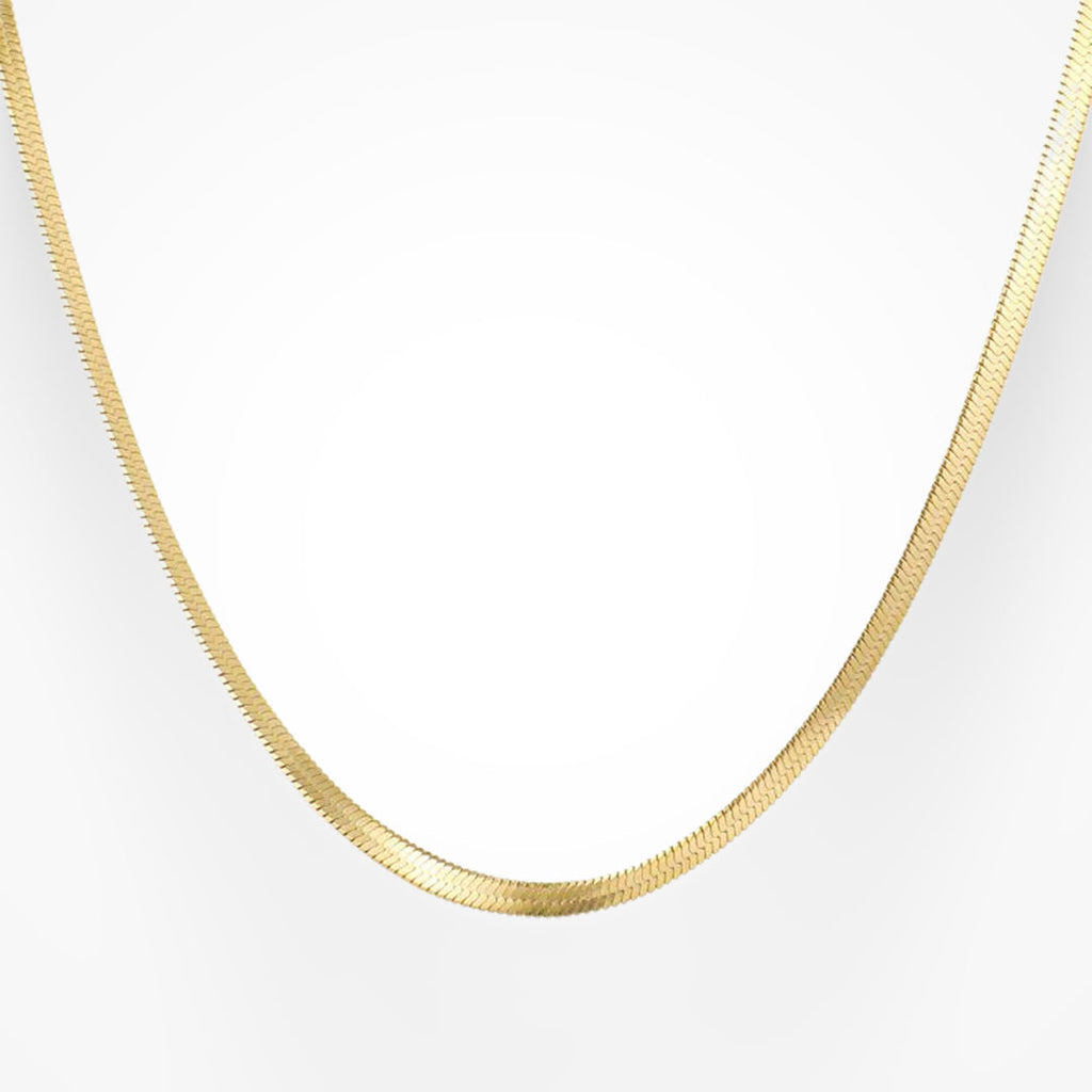 Gold snake pendant necklace with gleaming sculptural finish