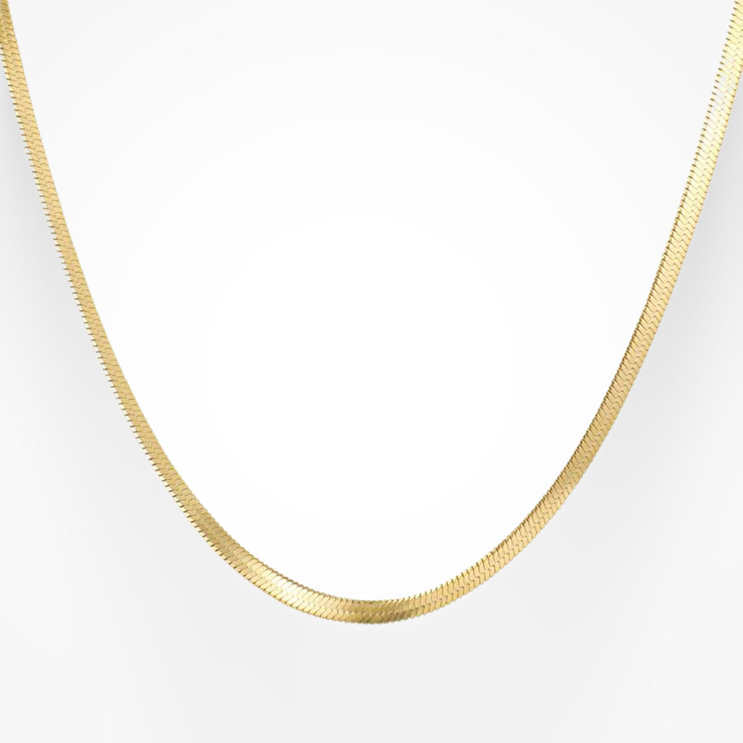 Gold snake pendant necklace with gleaming sculptural finish