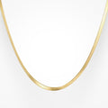 Gold snake pendant necklace with gleaming sculptural finish