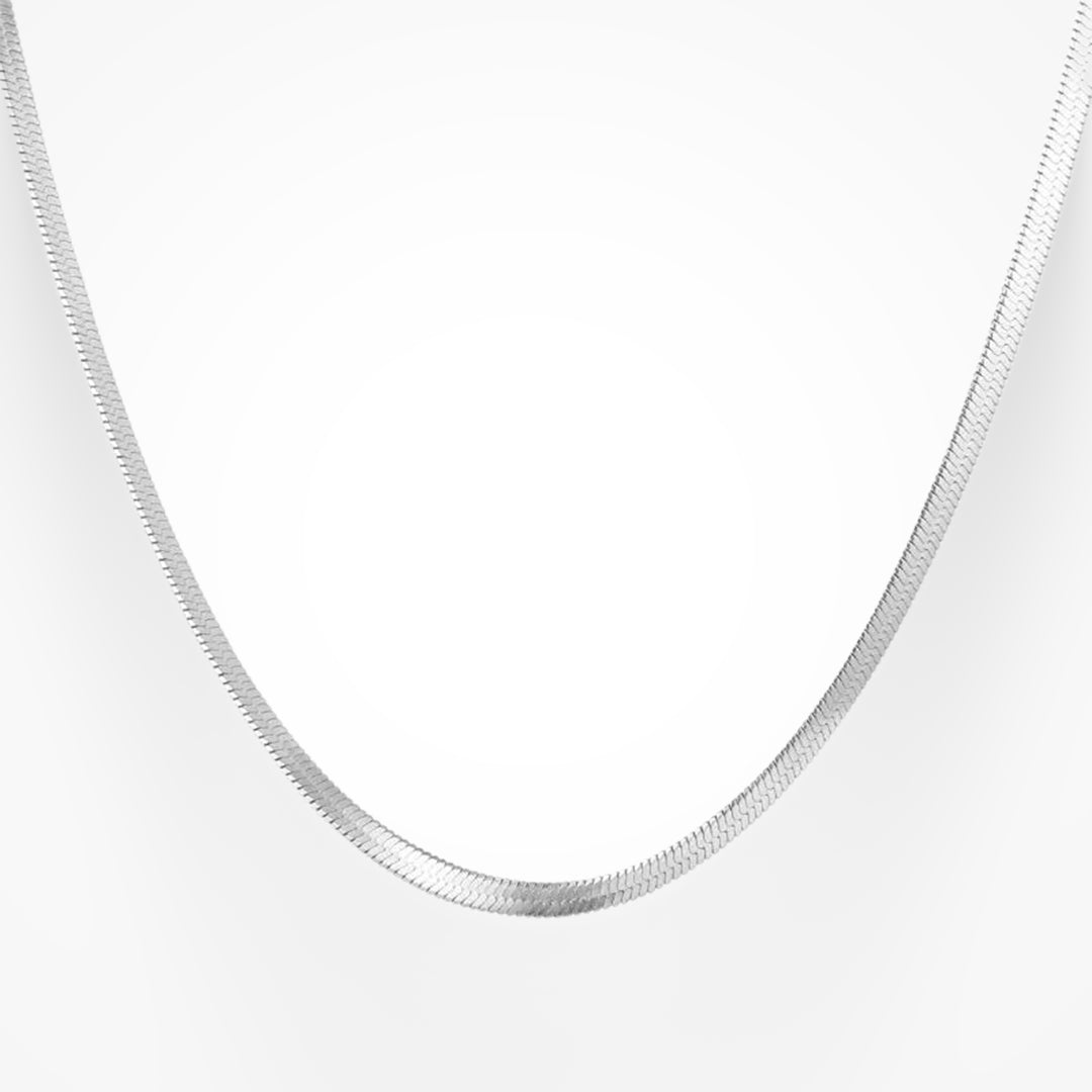 Gold snake pendant necklace with gleaming sculptural finish