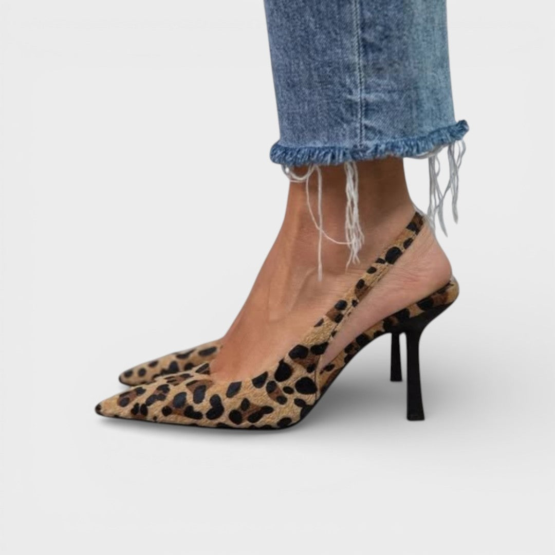Women's pointed-toe mid heels in leopard print with an adjustable ankle strap
