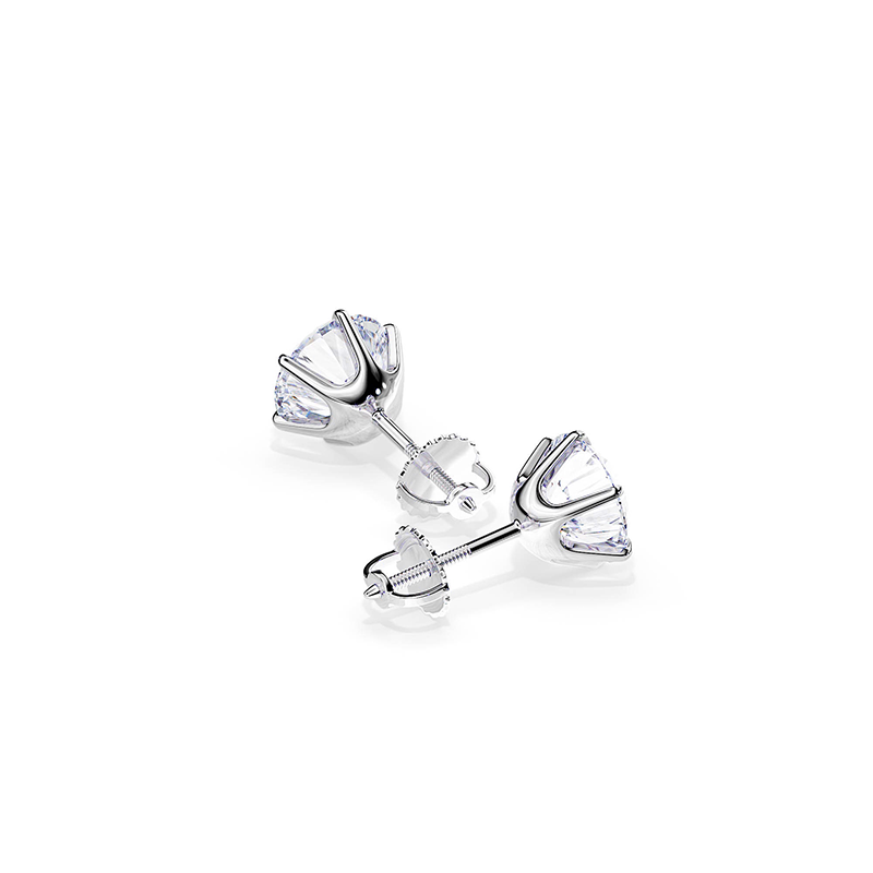 A pair of handcrafted sterling silver stud earrings with a curved, polished minimalist design