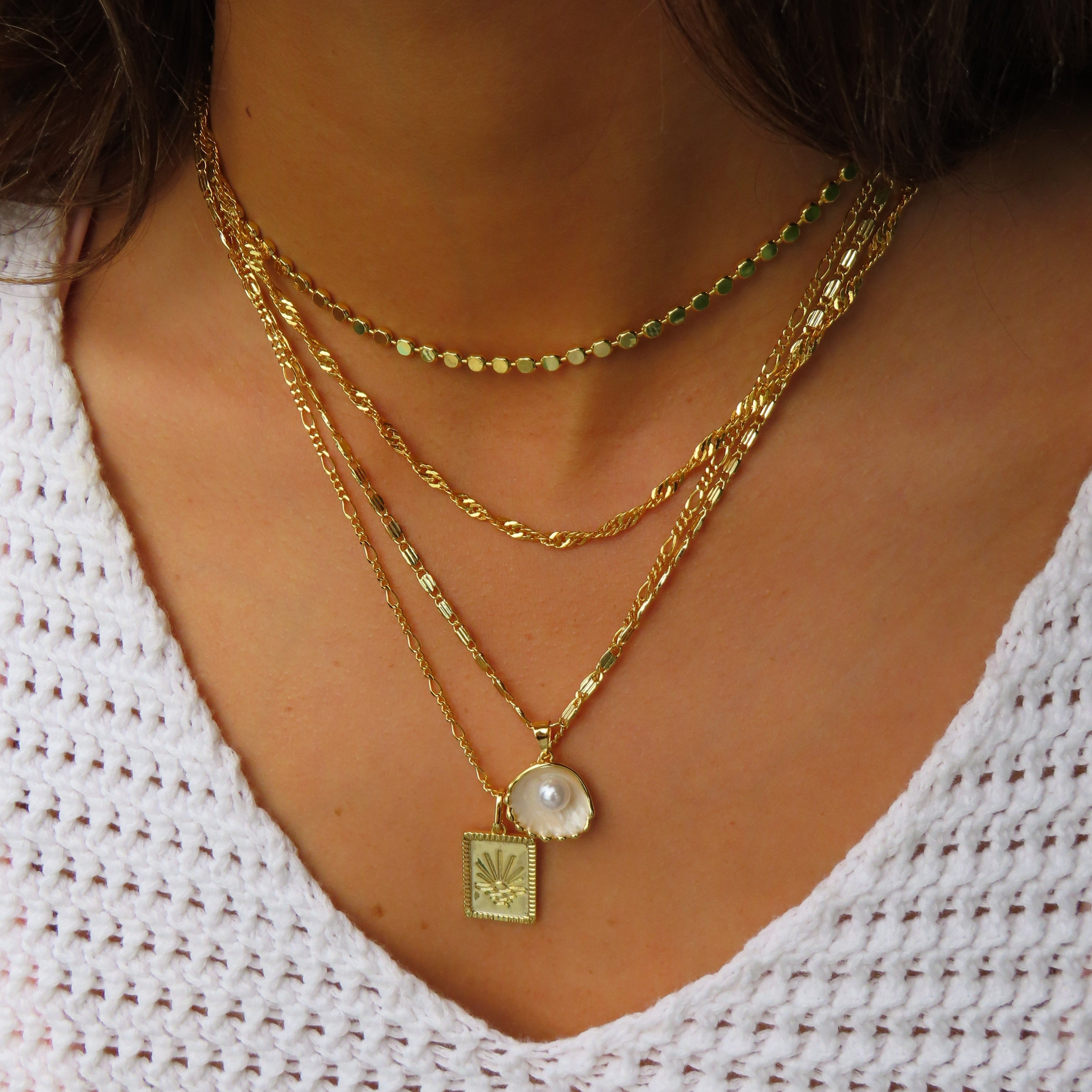 Gold radiant sun pendant necklace on fine polished chain