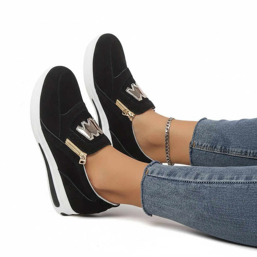 Women's black comfort slip-on shoes with a cushioned ergonomic sole and clean minimal design