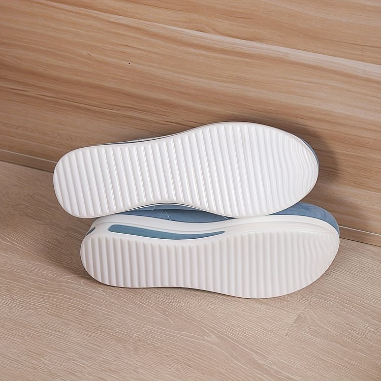 Women's black comfort slip-on shoes with a cushioned ergonomic sole and clean minimal design
