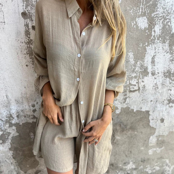 A woman wearing a relaxed beige button-front shirt with matching shorts