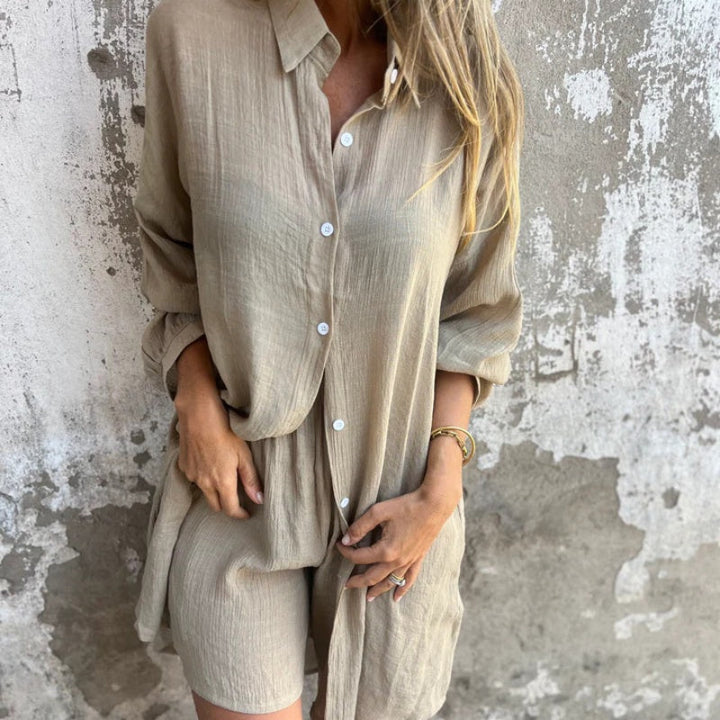 A woman wearing a buttoned polo top with matching flowing shorts