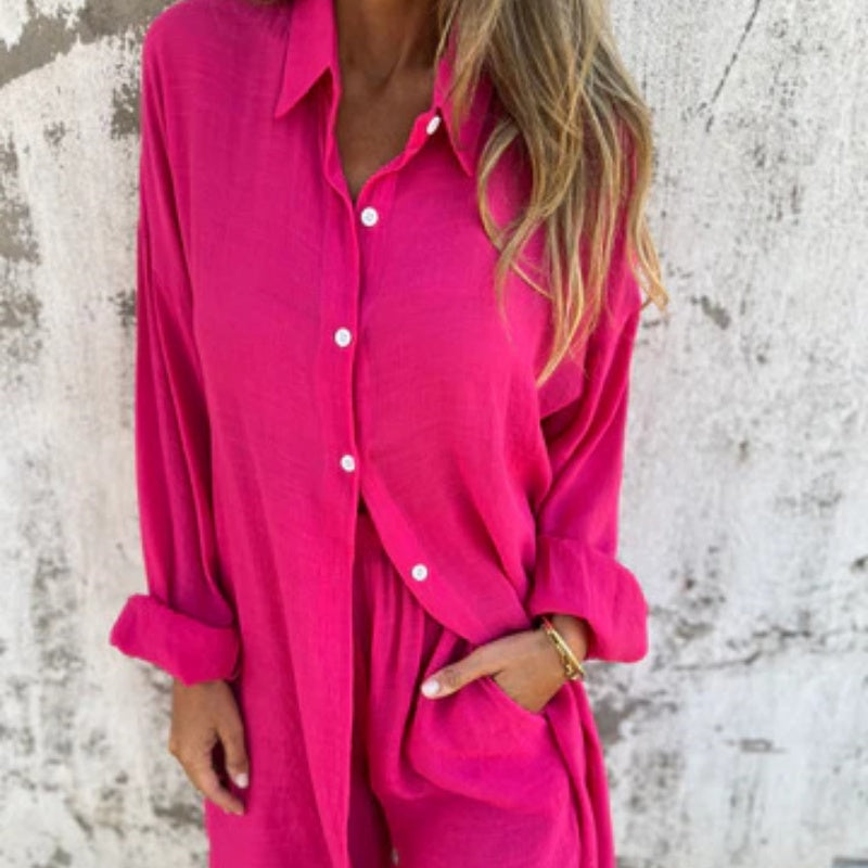 A woman wearing a buttoned polo top with matching flowing shorts