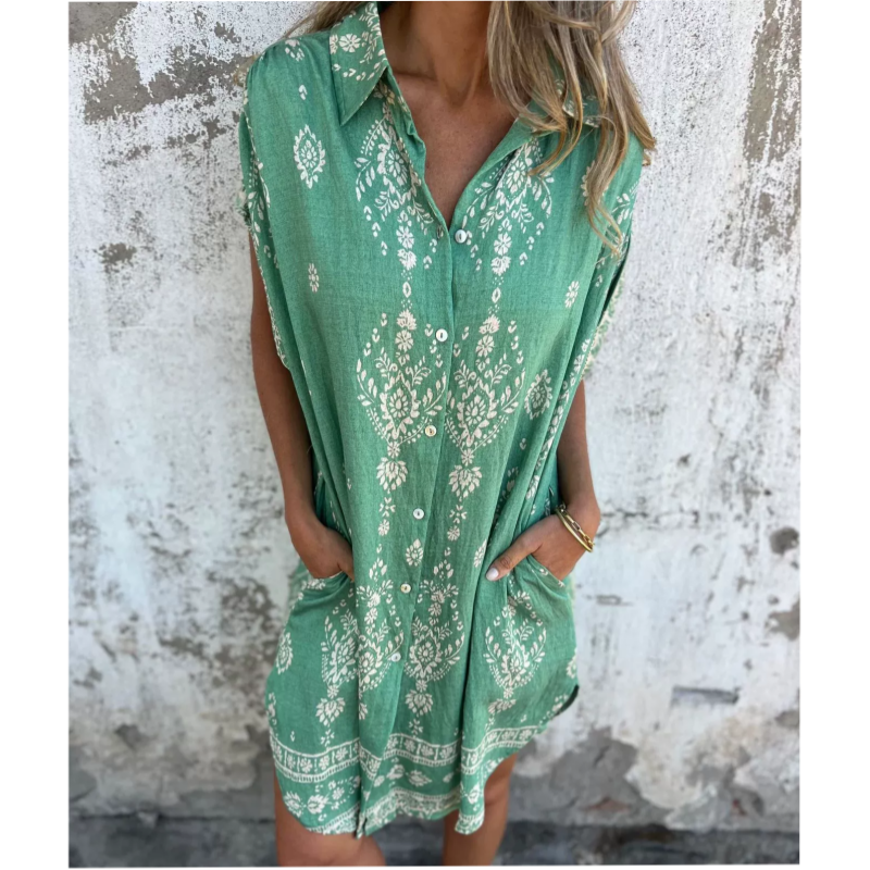 Woman wearing the Edith vintage print shirt dress with a button front and soft collar, standing in warm daylight.