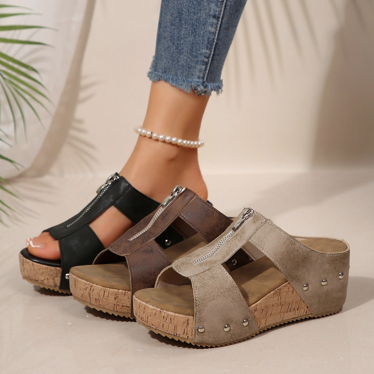 Black wedge sandals with side zip fastening and open design