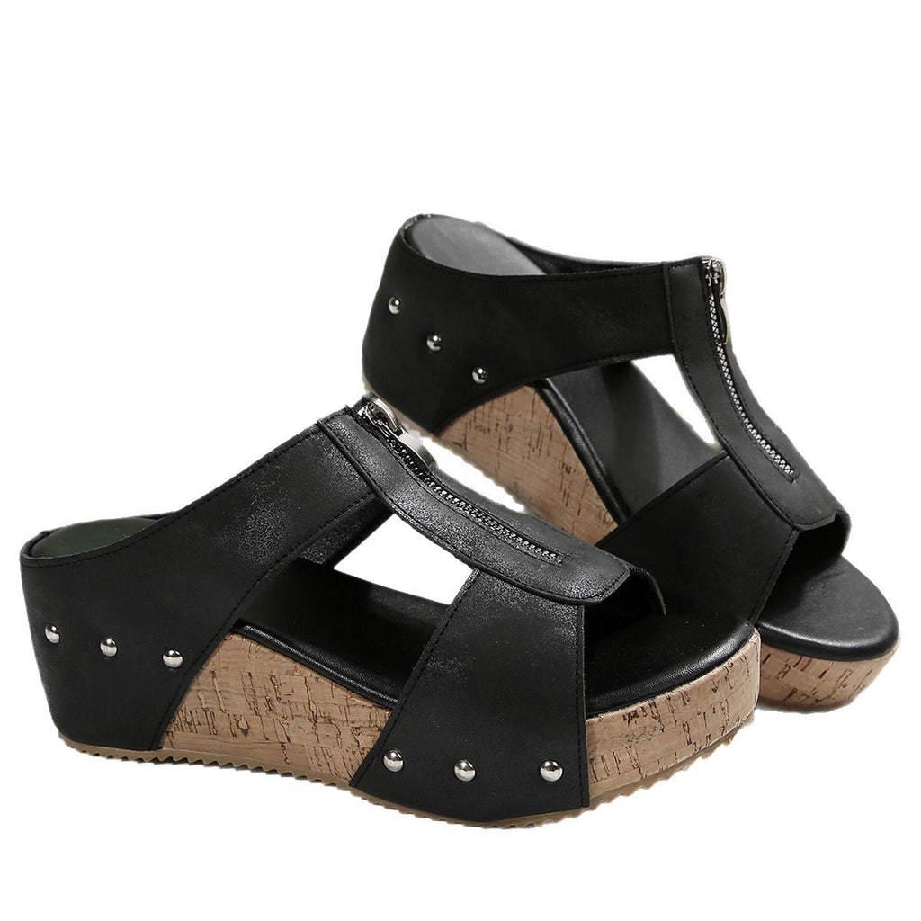 Black wedge sandals with side zip fastening and open design
