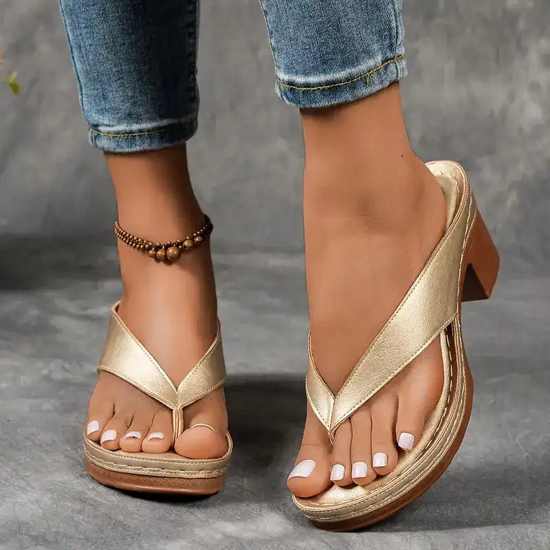 Heeled toe-post sandals with a wide block heel in black, champagne, white and brown