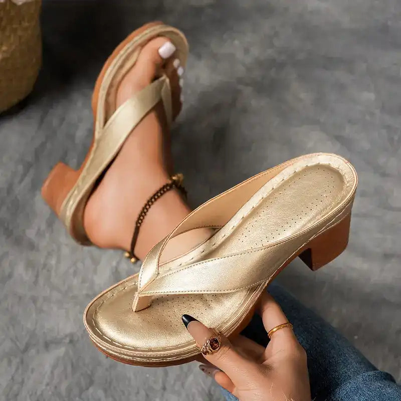 Heeled toe-post sandals with a wide block heel in black, champagne, white and brown