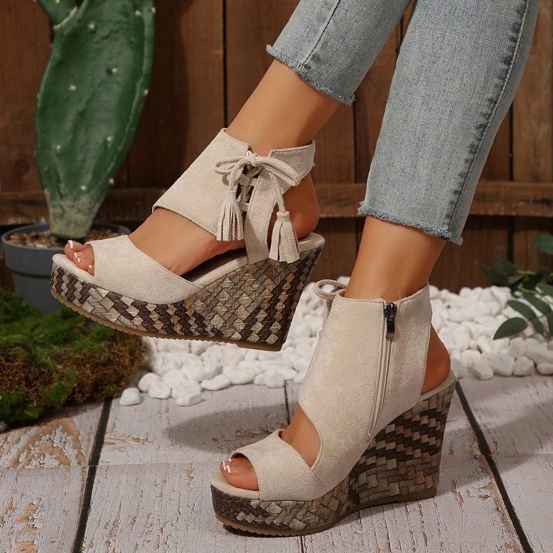 Boho wedge sandals in khaki with a trailing fringe detail at the back
