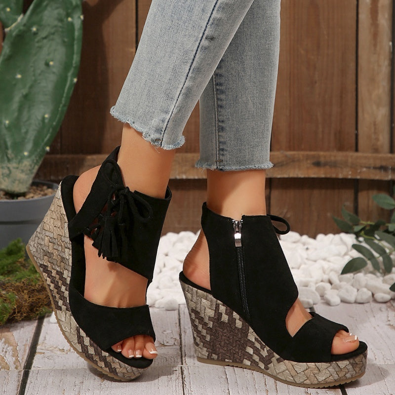 Boho wedge sandals in khaki with a trailing fringe detail at the back