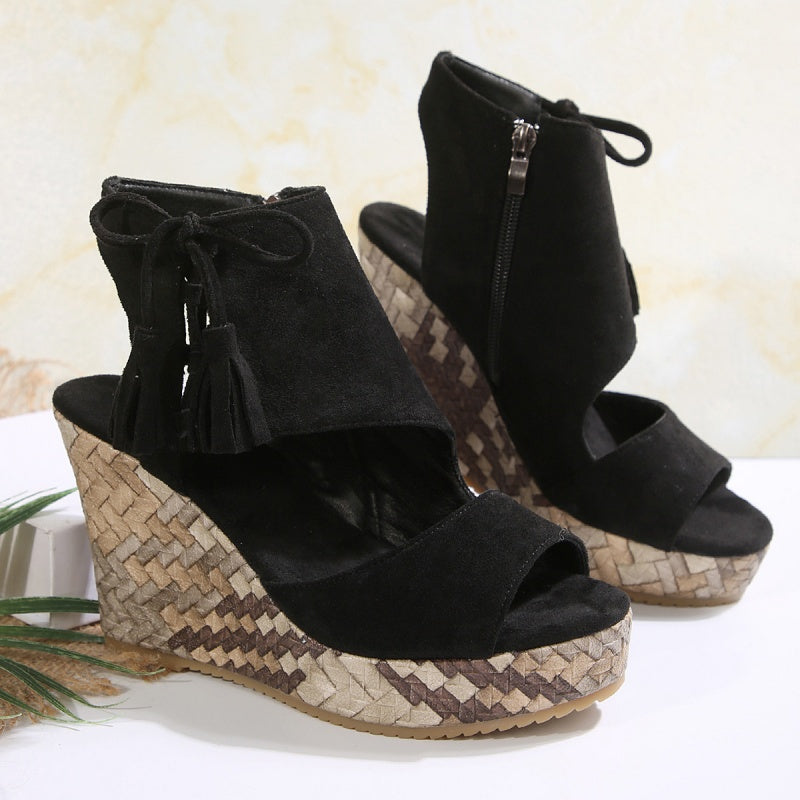 Boho wedge sandals in khaki with a trailing fringe detail at the back