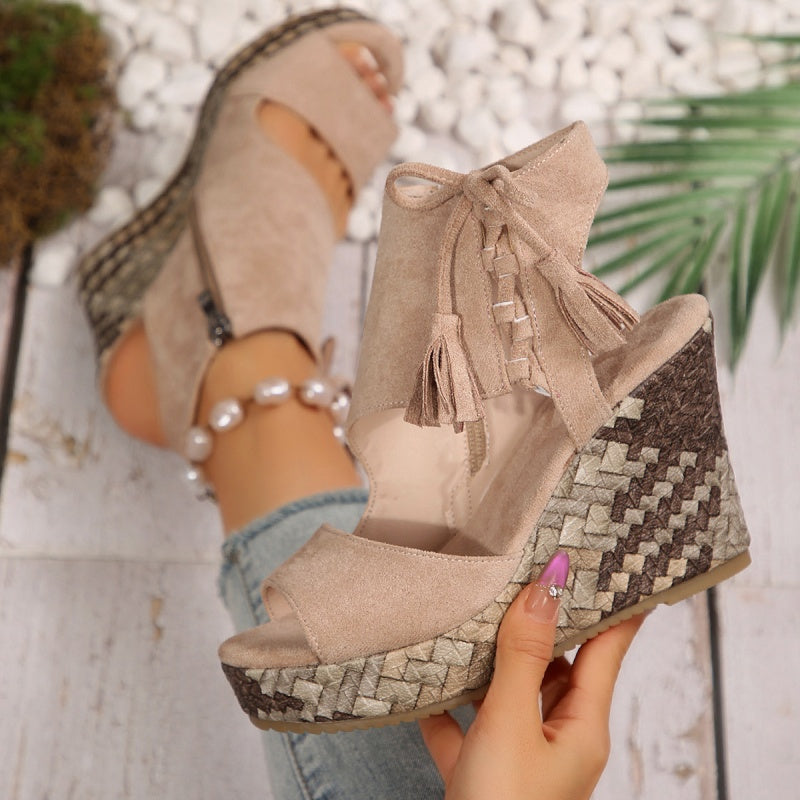 Boho wedge sandals in khaki with a trailing fringe detail at the back