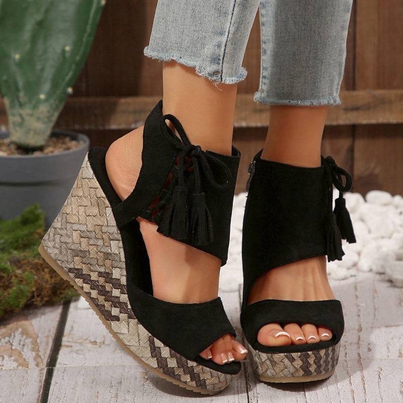 Boho wedge sandals in khaki with a trailing fringe detail at the back