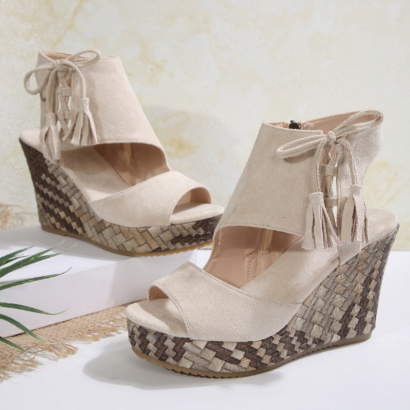 Boho wedge sandals in khaki with a trailing fringe detail at the back
