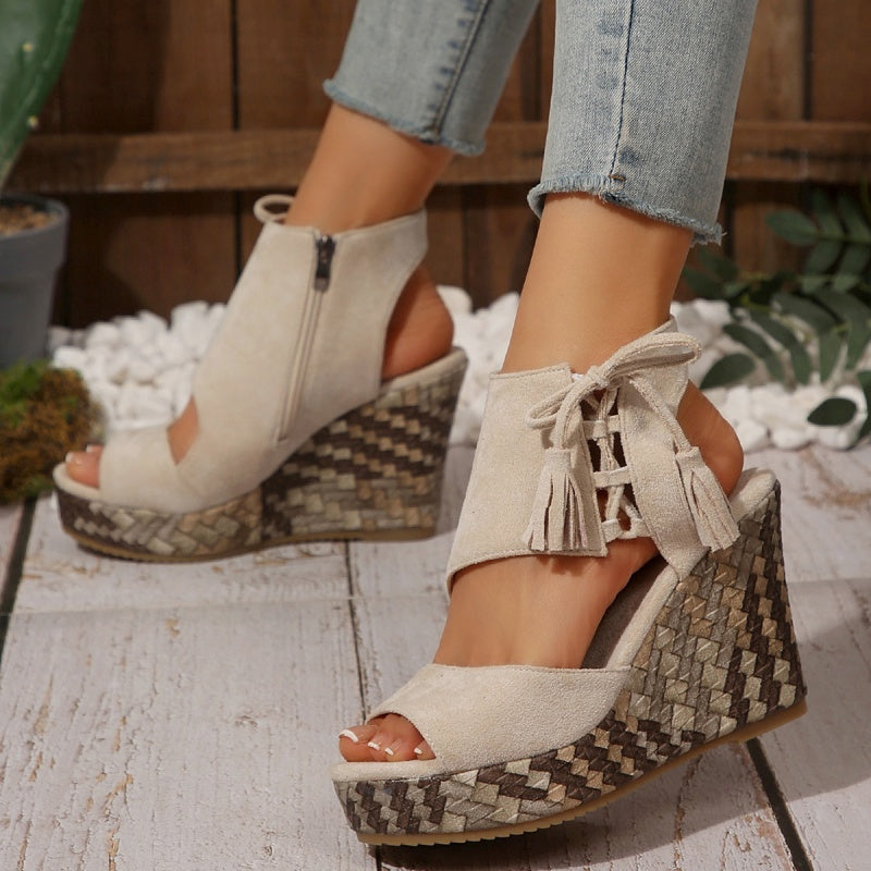 Boho wedge sandals in khaki with a trailing fringe detail at the back