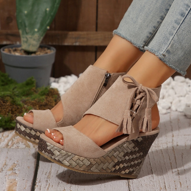 Boho wedge sandals in khaki with a trailing fringe detail at the back
