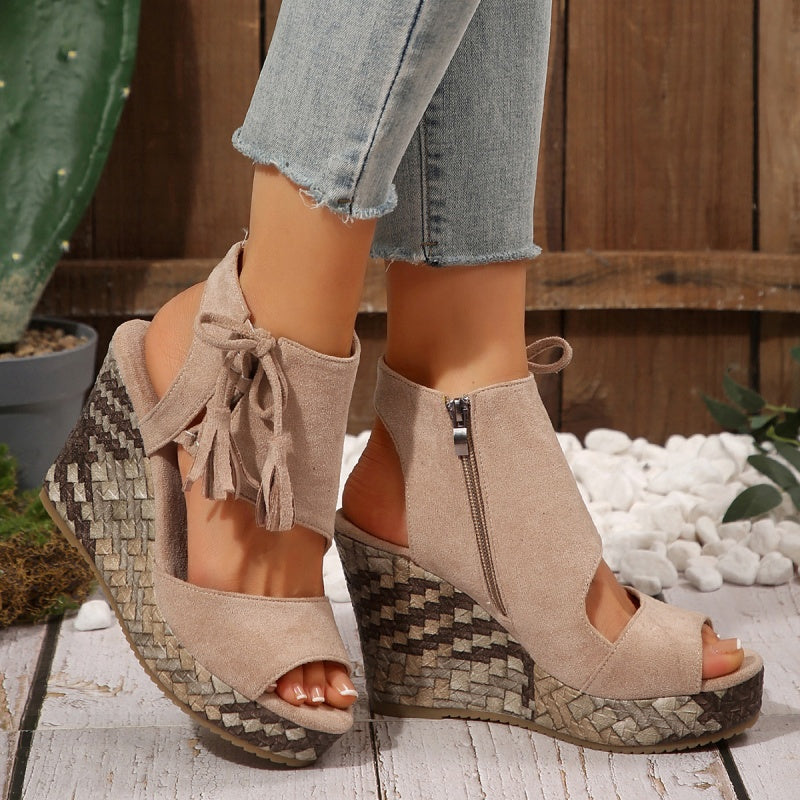 Boho wedge sandals in khaki with a trailing fringe detail at the back