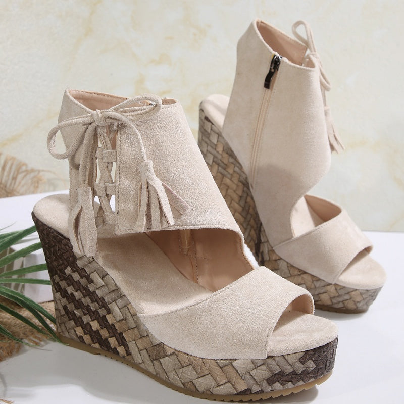 Boho wedge sandals in khaki with a trailing fringe detail at the back