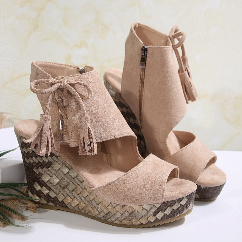 Boho wedge sandals in khaki with a trailing fringe detail at the back