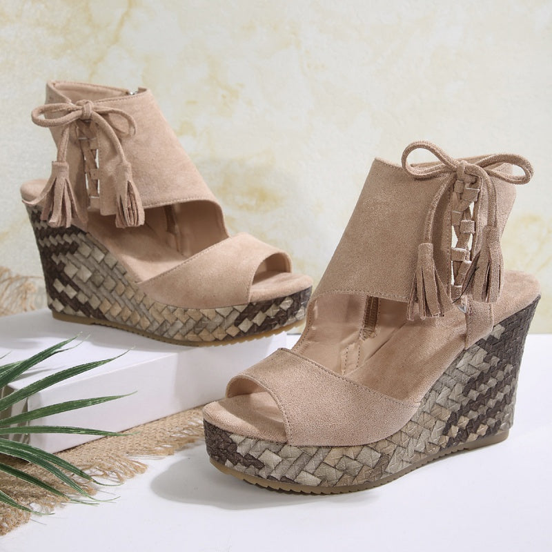 Boho wedge sandals in khaki with a trailing fringe detail at the back