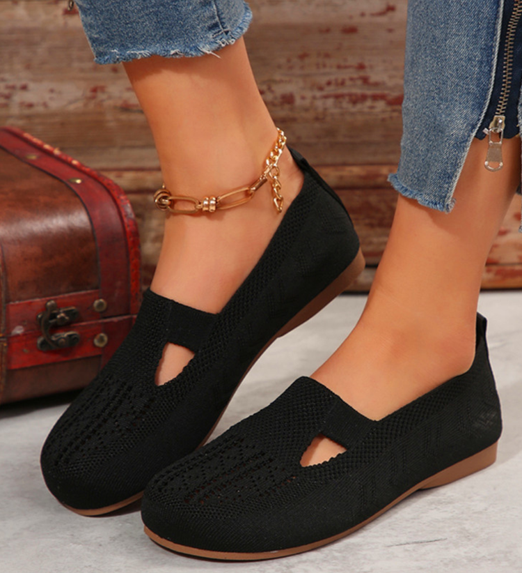 Closed breathable ballet flats in a warm beige tone with a clean, simple silhouette