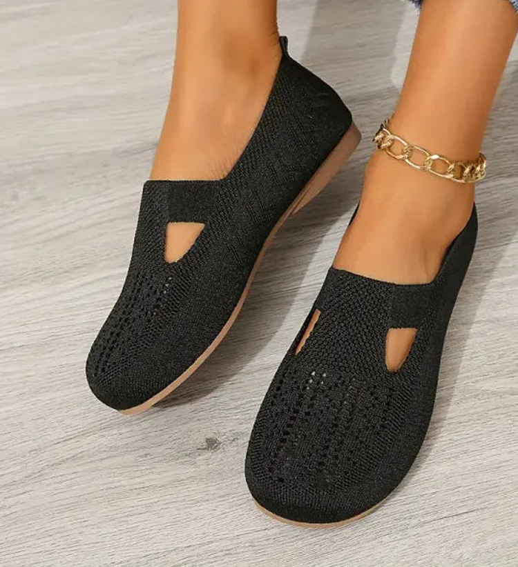 Closed breathable ballet flats in a warm beige tone with a clean, simple silhouette