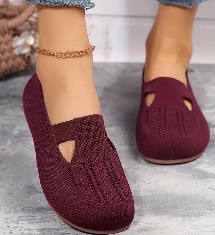 Closed breathable ballet flats in a warm beige tone with a clean, simple silhouette
