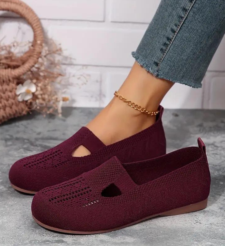 Closed breathable ballet flats in a warm beige tone with a clean, simple silhouette