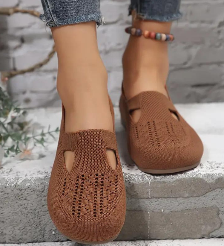 Closed breathable ballet flats in a warm beige tone with a clean, simple silhouette