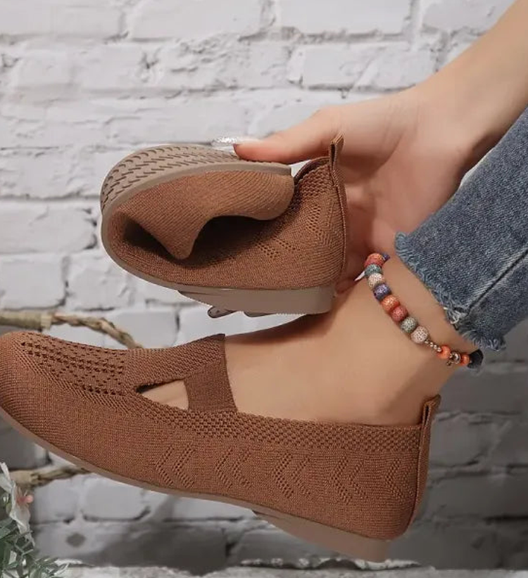 Closed breathable ballet flats in a warm beige tone with a clean, simple silhouette