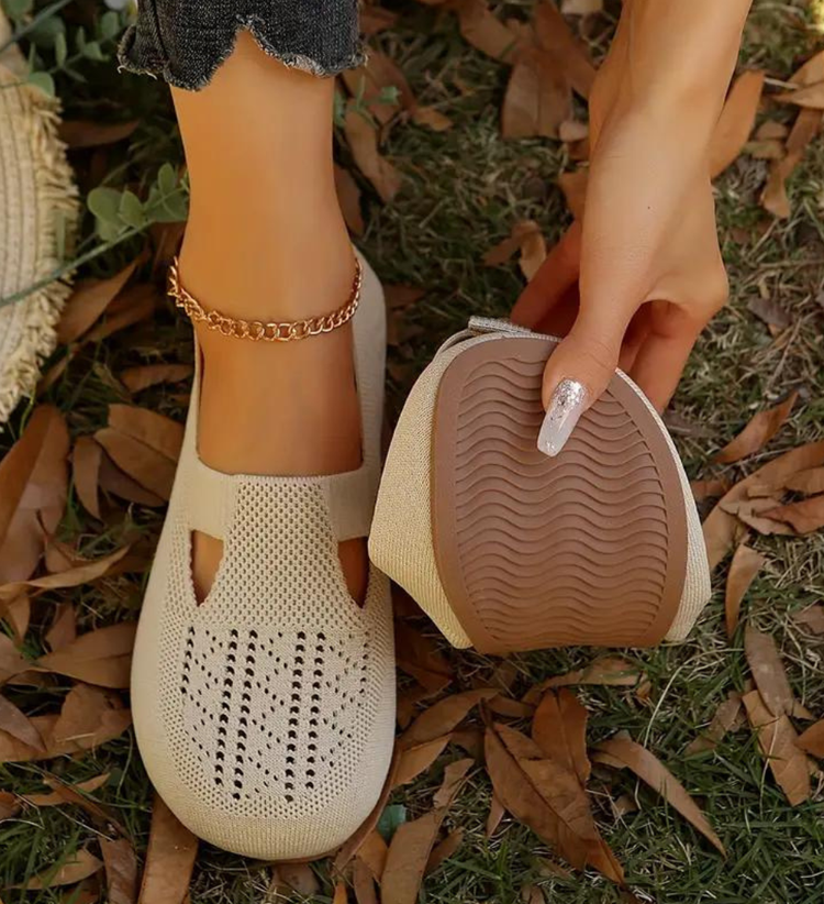 Closed breathable ballet flats in a warm beige tone with a clean, simple silhouette