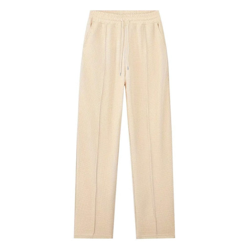 Men's lounge two-piece set in beige with a half-zip top and straight-leg trousers