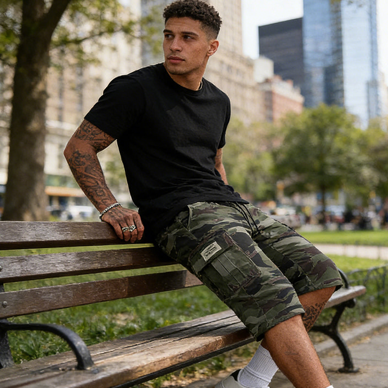 Men's olive cargo shorts with multiple side pockets and a relaxed urban fit
