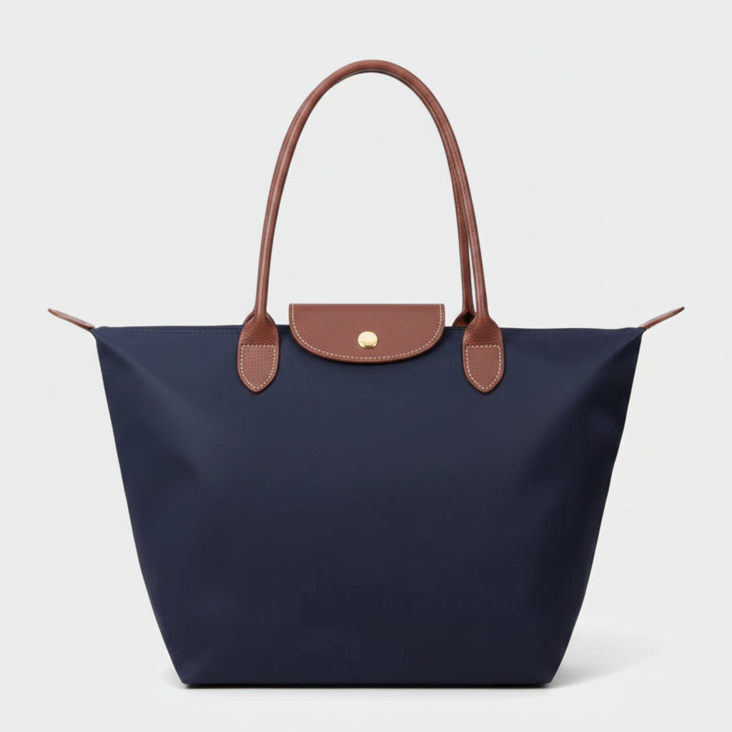 Classic structured tote bag in navy with contrast handles, shown in multiple colours
