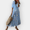 A floaty boho maxi dress in soft blue, styled with relaxed elegance for a summer day