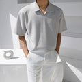 Men's light grey relaxed oversize polo shirt with a partial button collar