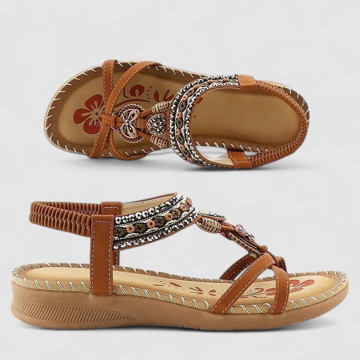 A woman standing comfortably in beige cushioned sandals with adjustable straps and a wide fit.