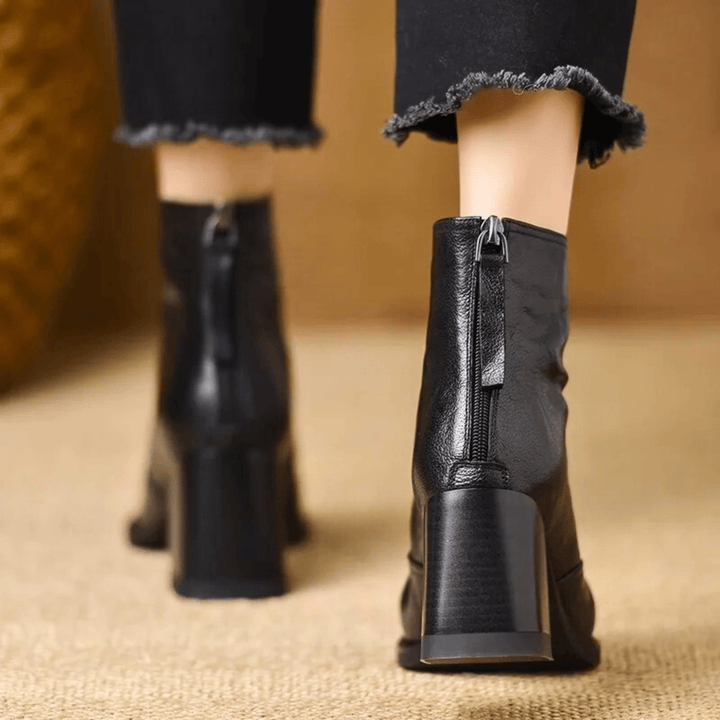 Sculpted heel ankle boots in espresso and midnight with a tailored ankle silhouette and back zip