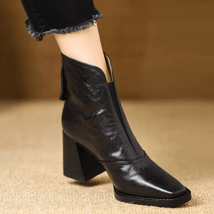 Sculpted heel ankle boots in espresso and midnight with a tailored ankle silhouette and back zip