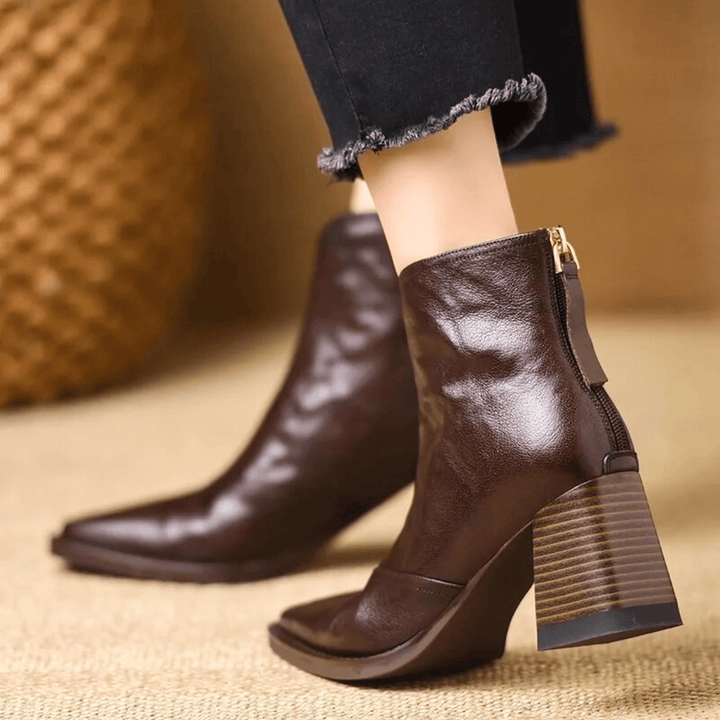 Sculpted heel ankle boots in espresso and midnight with a tailored ankle silhouette and back zip