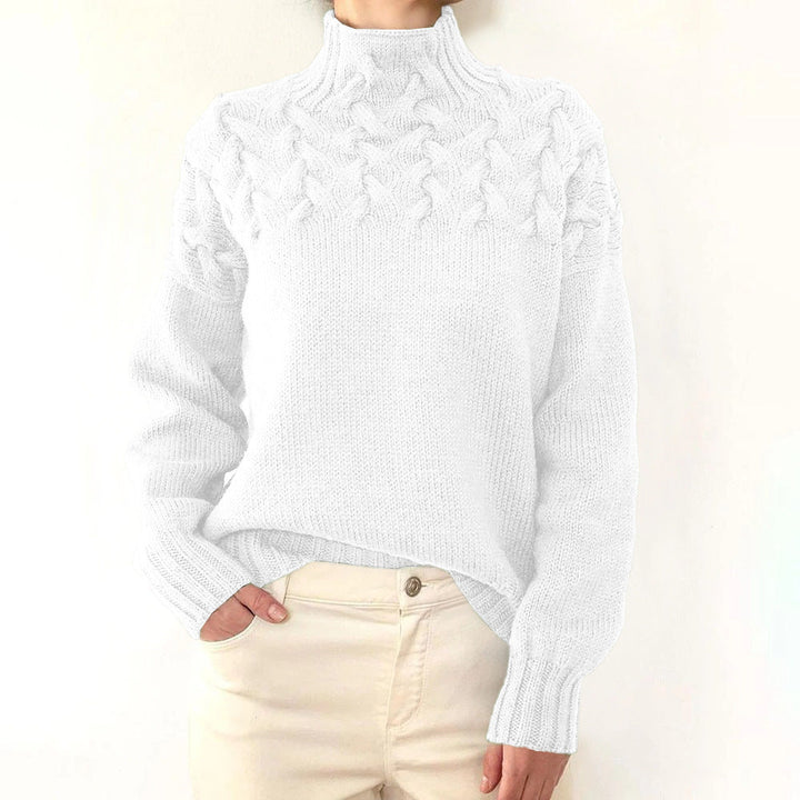 A woman wearing a warm roll-neck jumper, cosy and elegant on a cold winter day.