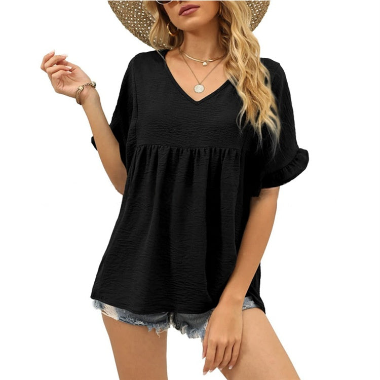 Black relaxed casual top with subtle frill details at the neckline and a flowing summer silhouette